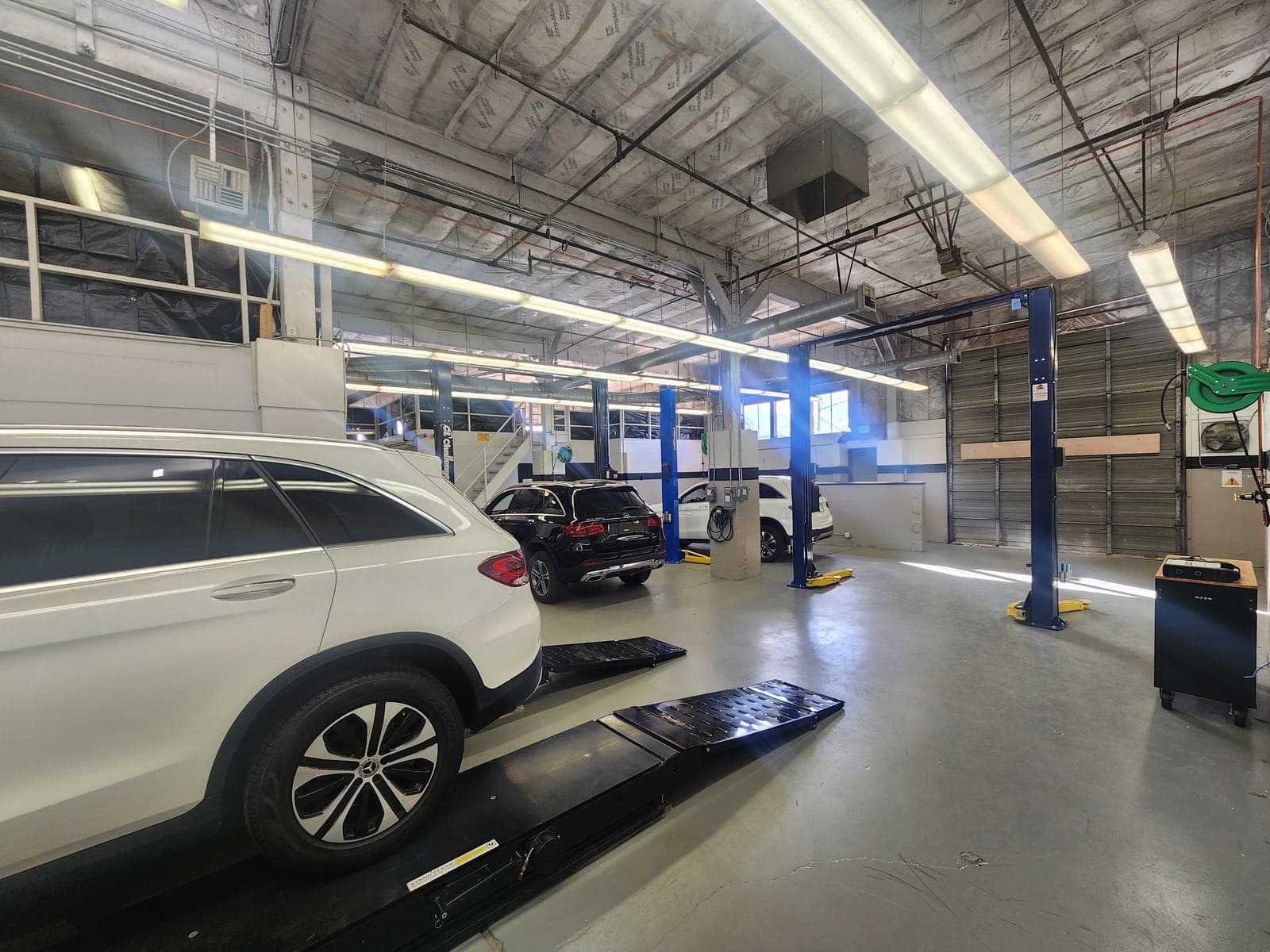 Service bay with vehicle on lift at MB Drive JC facility