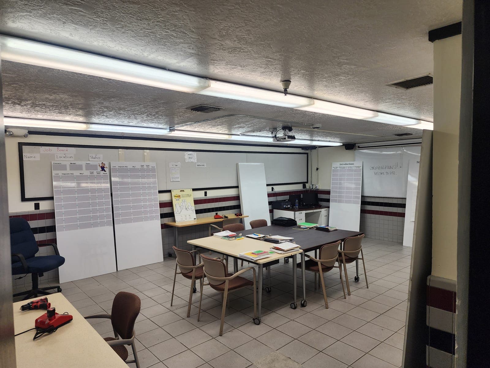 Classroom and planning area with whiteboards and instructional materials