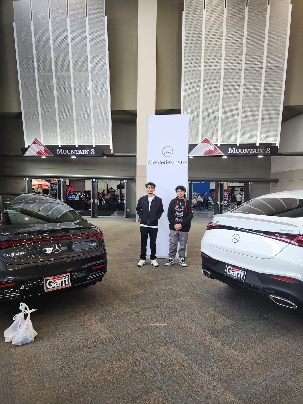 Two individuals at a Mercedes-Benz location