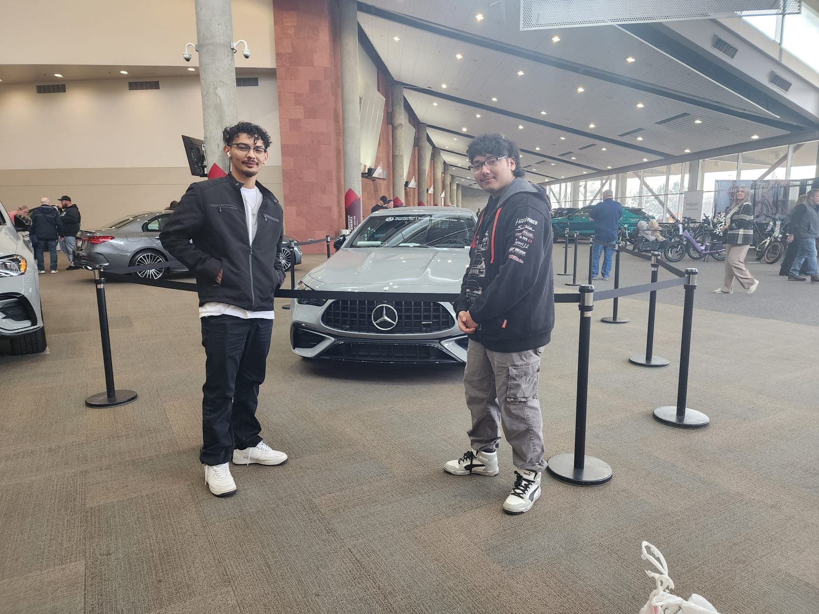 Two students at a Mercedes-Benz showroom